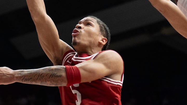 Feb 18, 2026; Tuscaloosa, AL, USA; Arkansas guard Darius Acuff Jr. (5) scores inside against Alabama forward Aiden Sherrell (22) at Coleman Coliseum. Alabama defeated Arkansas 117-115 in double overtime. Acuff Jr. led all scorers with a career high of 49 points. Mandatory Credit: Gary Cosby Jr.-Tuscaloosa News Feb 18, 2026; Tuscaloosa, AL, USA; Arkansas guard Darius Acuff Jr. (5) scores inside against Alabama forward Aiden Sherrell (22) at Coleman Coliseum. Alabama defeated Arkansas 117-115 in double overtime. Acuff Jr. led all scorers with a career high of 49 points. Mandatory Credit: Gary Cosby Jr.-Tuscaloosa News