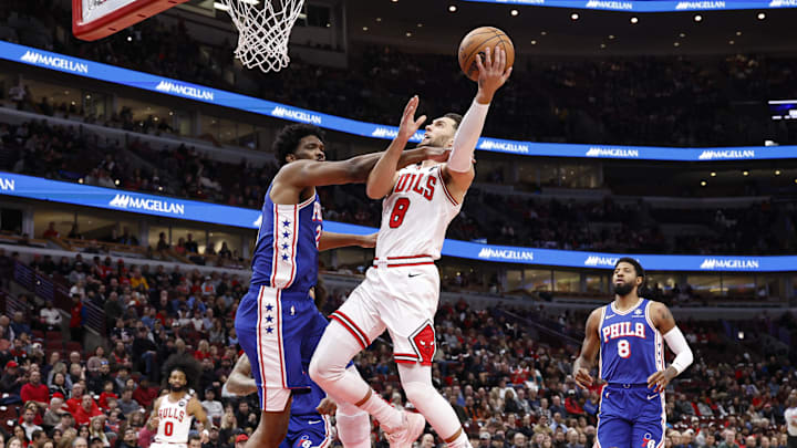 Chicago Bulls guard Zach LaVine (8) drives to the basket against Philadelphia 76ers center Joel Embiid (21) during the first half at United Center. Mandatory Credit: Kamil Krzaczynski-Imagn Images Chicago Bulls guard Zach LaVine (8) drives to the basket against Philadelphia 76ers center Joel Embiid (21) during the first half at United Center. Mandatory Credit: Kamil Krzaczynski-Imagn Images
