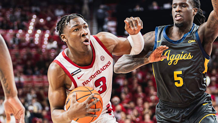 Adou Thiero (3) drives to the basket against the North Carolina A&T Aggies inside Bud Walton Arena. 