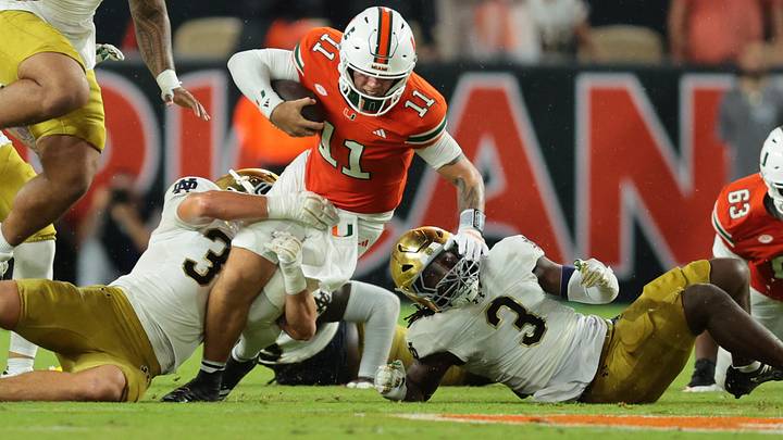 Aug 31, 2025; Miami Gardens, Florida, USA; Miami Hurricanes quarterback Carson Beck (11) rushes the ball against the Notre Dame Fighting Irish during the second quarter at Hard Rock Stadium. Aug 31, 2025; Miami Gardens, Florida, USA; Miami Hurricanes quarterback Carson Beck (11) rushes the ball against the Notre Dame Fighting Irish during the second quarter at Hard Rock Stadium.
