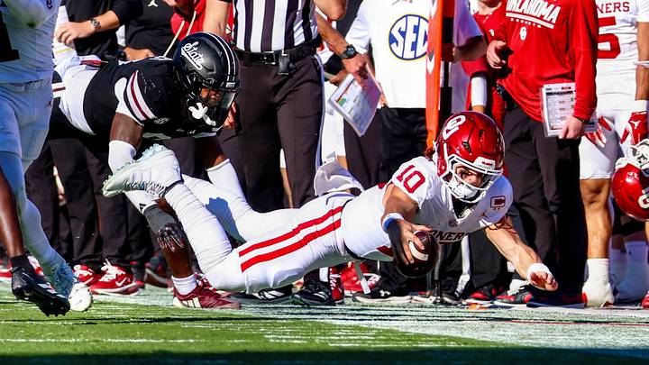 Oklahoma quarterback John Mateer dives against Mississippi State. Oklahoma quarterback John Mateer dives against Mississippi State.