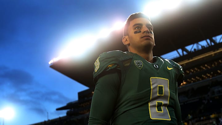 Marcus Mariota waits for a television interview after the Ducks' 44-10 win over the Buffaloes at Autzen Stadium in Eugene on Saturday, November 22, 2014.