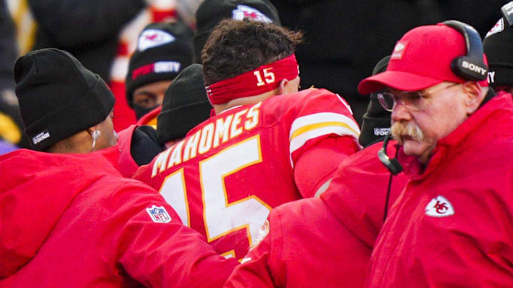 Dec 14, 2025; Kansas City, Missouri, USA; Kansas City Chiefs quarterback Patrick Mahomes (15) is attended to by team medical staff following an injury during the fourth quarter against the Los Angeles Chargers at GEHA Field at Arrowhead Stadium. Kansas City Chiefs head coach Andy Reid, second from right, stands on the sideline Mandatory Credit: Jay Biggerstaff-Imagn Images