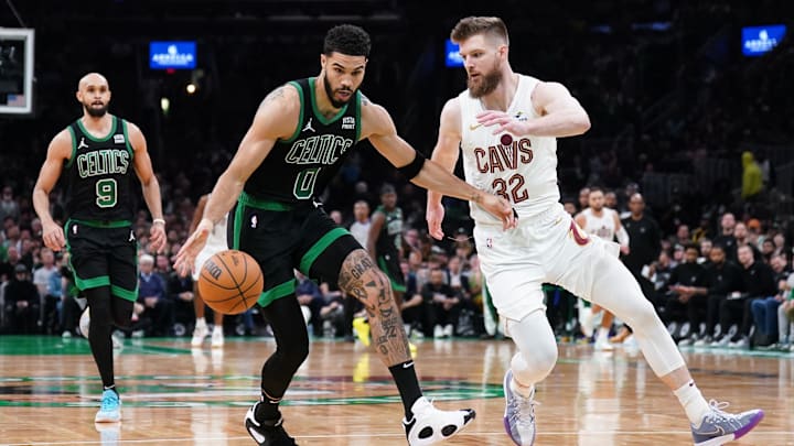 May 15, 2024; Boston, Massachusetts, USA; Boston Celtics forward Jayson Tatum (0) drives the ball against Cleveland Cavaliers forward Dean Wade (32) in the third quarter during game five of the second round for the 2024 NBA playoffs at TD Garden. Mandatory Credit: David Butler II-Imagn Images