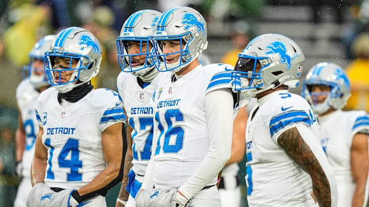 Detroit Lions wide receiver Amon-Ra St. Brown (14), wide receiver Tim Patrick (17), quarterback Jared Goff (16)
