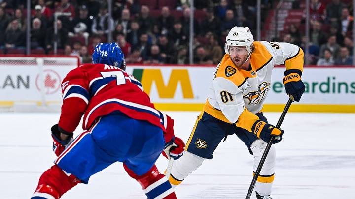 Dec 5, 2024; Montreal, Quebec, CAN; Nashville Predators center Jonathan Marchessault (81) plays the puck against Montreal Canadiens defenseman Arber Xhekaj (72) during the third period at Bell Centre. Mandatory Credit: David Kirouac-Imagn Images Dec 5, 2024; Montreal, Quebec, CAN; Nashville Predators center Jonathan Marchessault (81) plays the puck against Montreal Canadiens defenseman Arber Xhekaj (72) during the third period at Bell Centre. Mandatory Credit: David Kirouac-Imagn Images