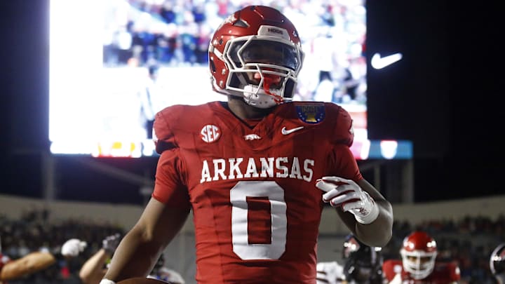 Dec 27, 2024; Memphis, TN, USA; Arkansas Razorbacks running back Braylen Russell (0) reacts after a touchdown during the first quarter against the Texas Tech Red Raiders at Simmons Bank Liberty Stadium. Mandatory Credit: Petre Thomas-Imagn Images
