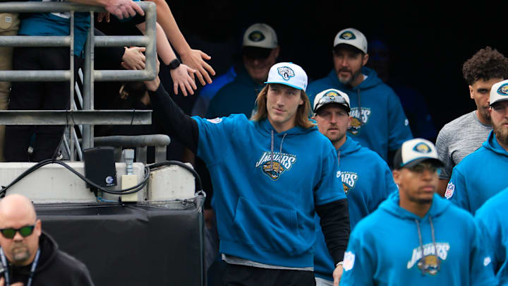 Jacksonville Jaguars quarterback Trevor Lawrence (16) high-fives a fan before an NFL football matchup Sunday, Dec. 15, 2024 at EverBank Stadium in Jacksonville, Fla. [Corey Perrine/Florida Times-Union]