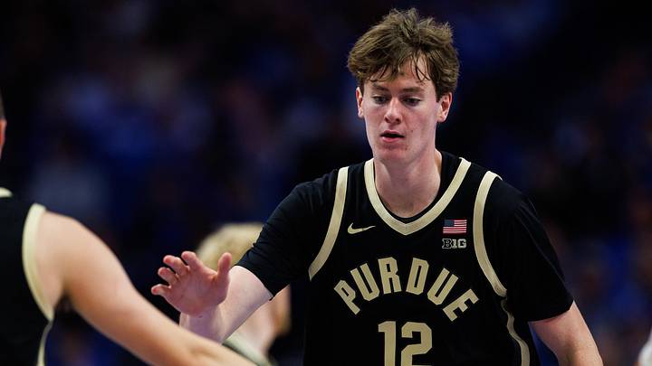 Purdue Boilermakers center Daniel Jacobsen (12) fives guard Fletcher Loyer (2). Purdue Boilermakers center Daniel Jacobsen (12) fives guard Fletcher Loyer (2).