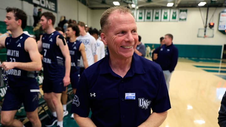 North Florida Ospreys head coach Matthew Driscoll is all smiles after the game of an NCAA men’s basketball matchup Saturday, Feb. 1, 2025 at Jacksonville University in Jacksonville, Fla. UNF held off a late rally from JU defeating them 81-78. [Corey Perrine/Florida Times-Union]