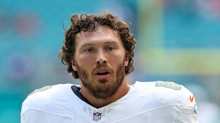 Miami Dolphins guard Cole Strange looks on before a game against the New England Patriots at Hard Rock Stadium