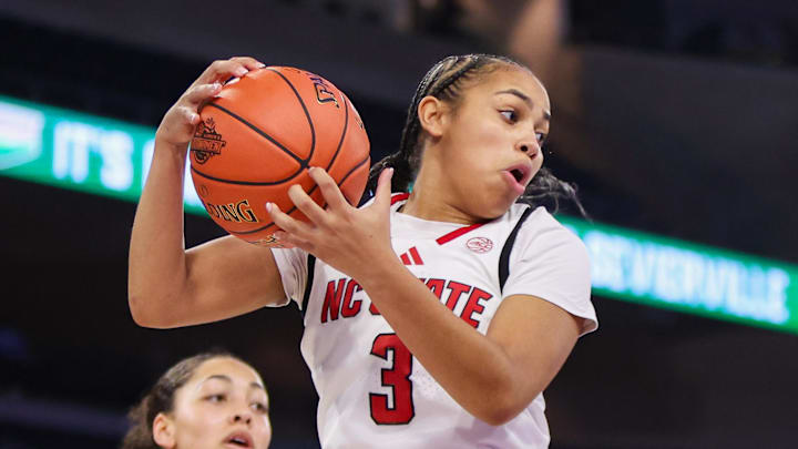 Mar 6, 2026; Duluth, GA, USA; North Carolina State Wolfpack guard Zamareya Jones (3) grabs a rebound against the Notre Dame Fighting Irish in the second quarter at Gas South Arena. Mandatory Credit: Brett Davis-Imagn Images