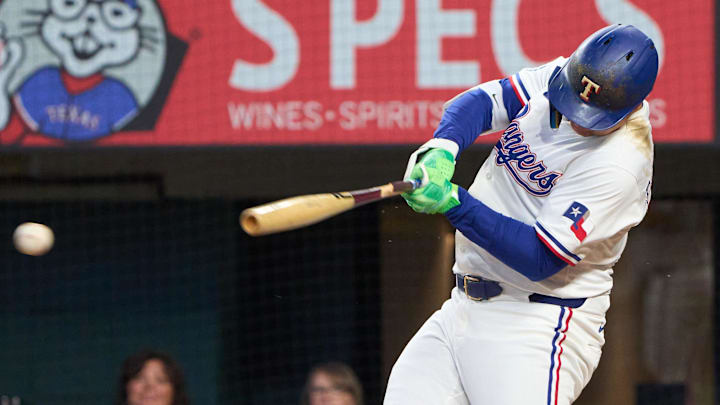 Texas Rangers designated hitter Joc Pederson swings his bat during a game.
