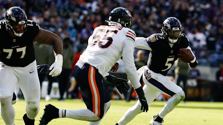Oct 26, 2025; Baltimore, Maryland, USA; Baltimore Ravens quarterback Tyler Huntley (5) runs with the ball as Chicago Bears defensive end Dayo Odeyingbo (55) chases in the third quarter at M&T Bank Stadium. Mandatory Credit: Geoff Burke-Imagn Images Oct 26, 2025; Baltimore, Maryland, USA; Baltimore Ravens quarterback Tyler Huntley (5) runs with the ball as Chicago Bears defensive end Dayo Odeyingbo (55) chases in the third quarter at M&T Bank Stadium. Mandatory Credit: Geoff Burke-Imagn Images