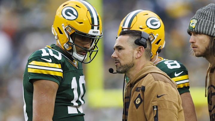 Green Bay Packers head coach Matt LaFleur talks with quarterback Jordan Love (10) during the second quarter against the Los Angeles Rams at Lambeau Field.