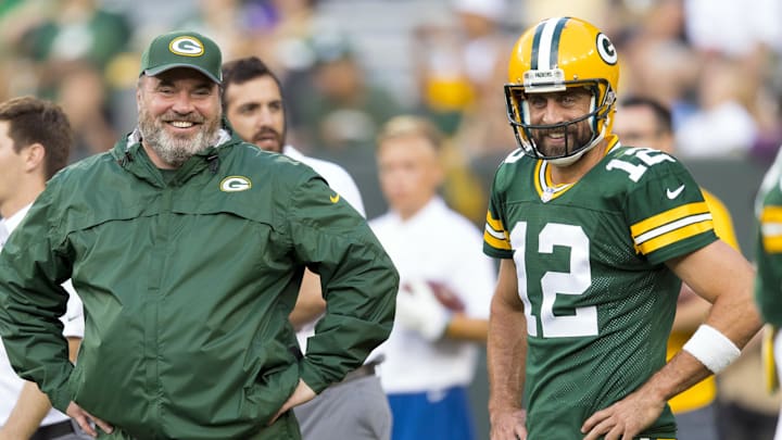 Aug 10, 2017; Green Bay, WI, USA; Green Bay Packers head coach Mike McCarthy talks with quarterback Aaron Rodgers (12) during warmups prior to the game against the Philadelphia Eagles at Lambeau Field. Mandatory Credit: Jeff Hanisch-Imagn Images
