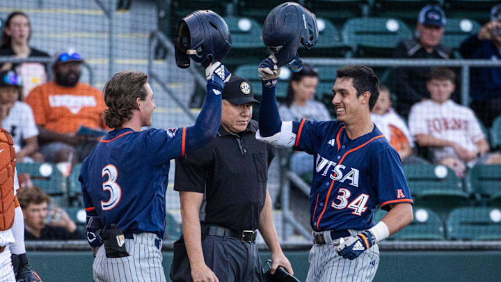 UTSA utility Caden Miller (34) celebrates with outfielder Mason Lytle (3) after scoring the first run of the game against the Texas Longhorns, March 18, 2025 at UFCU Disch-Falk Field in Austin.