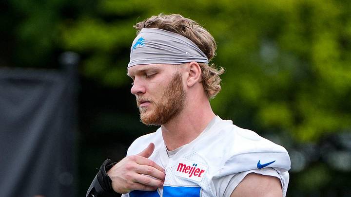 Detroit Lions defensive end Aidan Hutchinson (97) walks on to the field before practice during mini camp at Meijer Performance Center in Allen Park on Wednesday, June 17, 2026. Detroit Lions defensive end Aidan Hutchinson (97) walks on to the field before practice during mini camp at Meijer Performance Center in Allen Park on Wednesday, June 17, 2026.