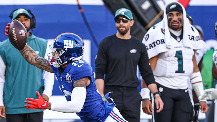 Oct 20, 2024; East Rutherford, New Jersey, USA; New York Giants wide receiver Jalin Hyatt (13) attempts to catch a pass in front of Philadelphia Eagles safety Tristin McCollum (36) during the second half at MetLife Stadium. Mandatory Credit: Vincent Carchietta-Imagn Images