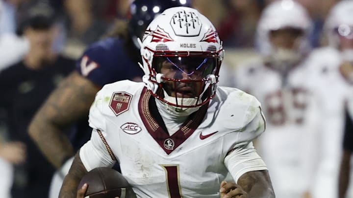 Sep 26, 2025; Charlottesville, Virginia, USA; Florida State Seminoles quarterback Tommy Castellanos (1) runs with the ball against the Virginia Cavaliers at Scott Stadium. Mandatory Credit: Geoff Burke-Imagn Images