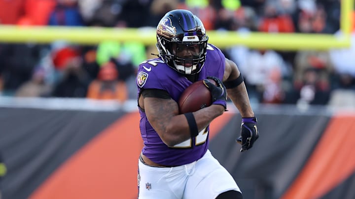 Dec 14, 2025; Cincinnati, Ohio, USA; Baltimore Ravens running back Derrick Henry (22) runs for a first down during the third quarter against the Cincinnati Bengals at Paycor Stadium. Mandatory Credit: Joseph Maiorana-Imagn Images