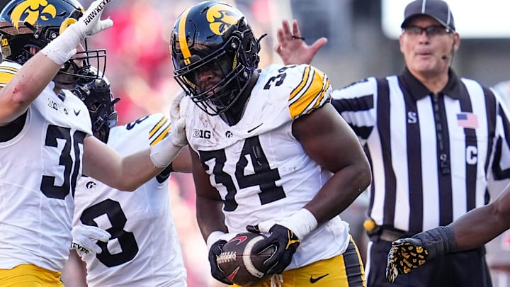 Oct 5, 2024; Columbus, OH, USA; Iowa Hawkeyes linebacker Jay Higgins (34) celebrates a fumble recovery after forcing Ohio State Buckeyes wide receiver Jeremiah Smith to lose the ball during the first half of the NCAA football game at Ohio Stadium.