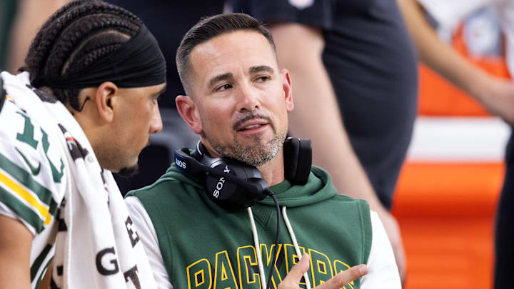 Green Bay Packers coach Matt LaFleur talks with quarterback Jordan Love during the game against the Arizona Cardinals. Green Bay Packers coach Matt LaFleur talks with quarterback Jordan Love during the game against the Arizona Cardinals.
