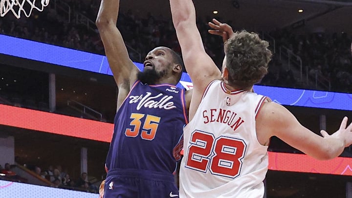Feb 23, 2024; Houston, Texas, USA; Phoenix Suns forward Kevin Durant (35) shoots the ball as Houston Rockets center Alperen Sengun (28) defends during the third quarter at Toyota Center. Mandatory Credit: Troy Taormina-Imagn Images