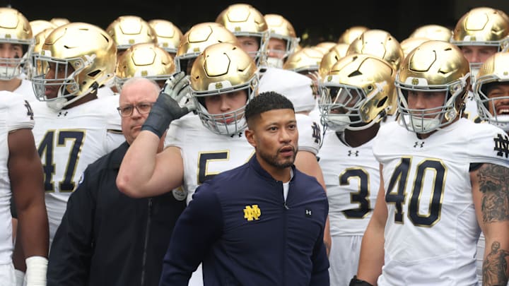Notre Dame Fighting Irish head coach Marcus Freeman leads his team onto the field to play the Pittsburgh Panthers at Acrisure Stadium. Notre Dame Fighting Irish head coach Marcus Freeman leads his team onto the field to play the Pittsburgh Panthers at Acrisure Stadium.