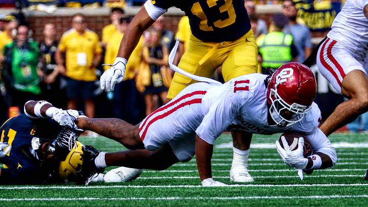 Oklahoma wide receiver Trell Harris gets tackled against Michigan.