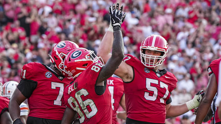 Georgia Bulldogs wide receiver Dillon Bell (86) reacts with offensive lineman Monroe Freeling (57) after catching a touchdown pass against the Auburn Tigers during the second half at Sanford Stadium. Georgia Bulldogs wide receiver Dillon Bell (86) reacts with offensive lineman Monroe Freeling (57) after catching a touchdown pass against the Auburn Tigers during the second half at Sanford Stadium.