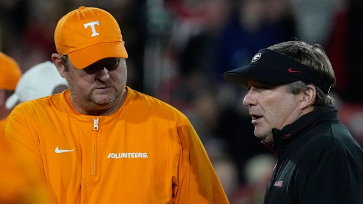 Tennessee head coach Josh Heupel shanks hands with Georgia head coach Kirby Smart before the start of a NCAA college football game against Tennessee in Athens, Ga., on Saturday, Nov. 16, 2024.