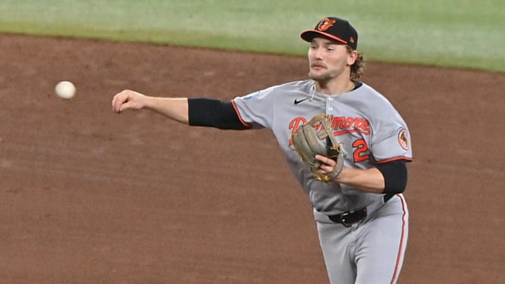 Apr 9, 2025; Phoenix, Arizona, USA;  Baltimore Orioles shortstop Gunnar Henderson (2) turns a double play on Arizona Diamondbacks shortstop Geraldo Perdomo (2) in the sixth inning at Chase Field.