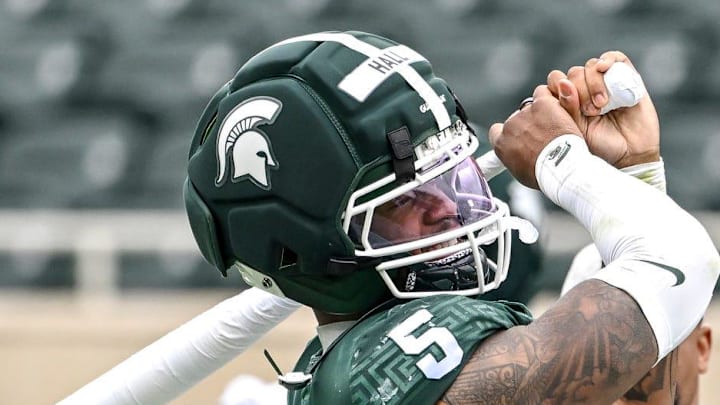 Michigan State's Jordan Hall swings a bat before participating in the bat spin relay hotdog eating competition during the football Spring Showcase on Saturday, April 18, 2026, at Spartan Stadium in East Lansing.