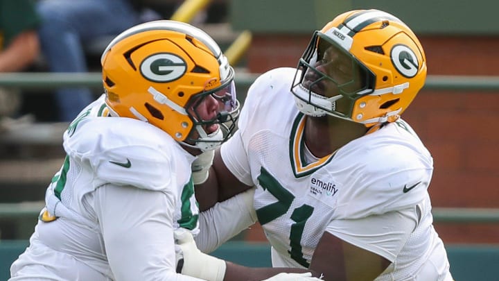 Green Bay Packers offensive linemen Anthony Belton blocks Zach Tom at training camp. Green Bay Packers offensive linemen Anthony Belton blocks Zach Tom at training camp.