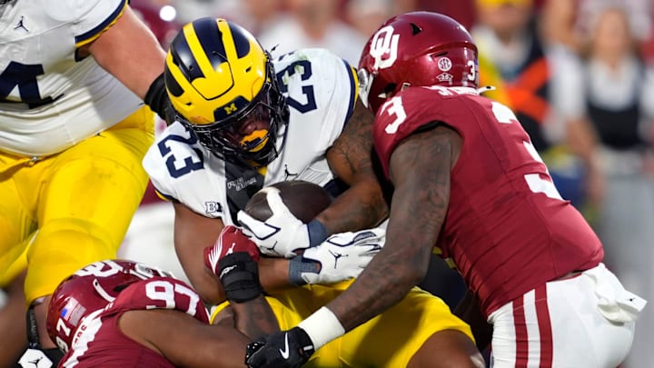 Oklahoma defensive back Robert Spears-Jennings brings down Michigan running back Jordan Marshall