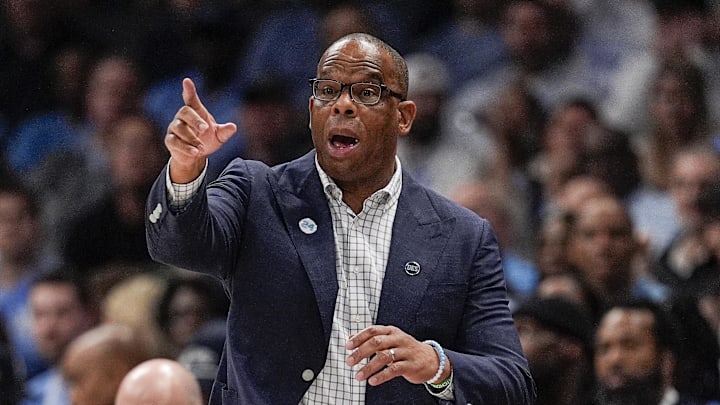 Dec 17, 2024; Charlotte, North Carolina, USA; North Carolina Tar Heels head coach Hubert Davis during the first half against the Florida Gators at Spectrum Center. Mandatory Credit: Jim Dedmon-Imagn Images Dec 17, 2024; Charlotte, North Carolina, USA; North Carolina Tar Heels head coach Hubert Davis during the first half against the Florida Gators at Spectrum Center. Mandatory Credit: Jim Dedmon-Imagn Images