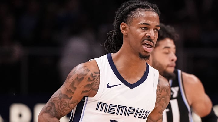 Dec 23, 2023; Atlanta, Georgia, USA; Memphis Grizzlies guard Ja Morant (12) reacts aft r making a three point basket against the Atlanta Hawks during the first half at State Farm Arena. Mandatory Credit: Dale Zanine-Imagn Images