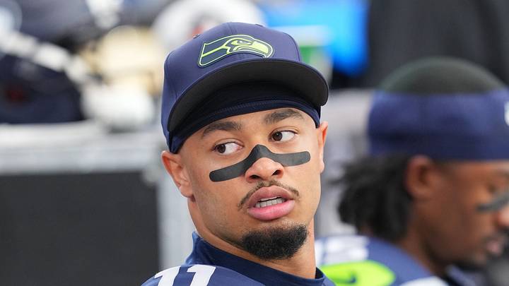 Seattle Seahawks wide receiver Jaxon Smith-Njigba looks on from the sideline