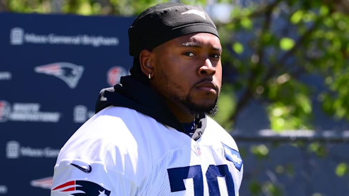 Jun 10, 2024; Foxborough, MA, USA; New England Patriots offensive tackle Caedan Wallace (70) walks to the practice fields for minicamp at Gillette Stadium. Mandatory Credit: Eric Canha-Imagn Images