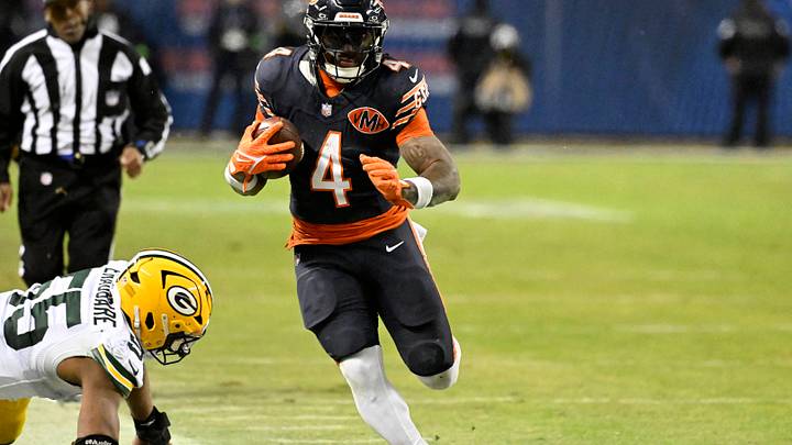 Jan 10, 2026; Chicago, IL, USA; Chicago Bears running back D'Andre Swift (4) runs runs after the catch as Green Bay Packers defensive end Kingsley Enagbare (55) defends during the second half of an NFC Wild Card Round game at Soldier Field. Mandatory Credit: Matt Marton-Imagn Images Jan 10, 2026; Chicago, IL, USA; Chicago Bears running back D'Andre Swift (4) runs runs after the catch as Green Bay Packers defensive end Kingsley Enagbare (55) defends during the second half of an NFC Wild Card Round game at Soldier Field. Mandatory Credit: Matt Marton-Imagn Images
