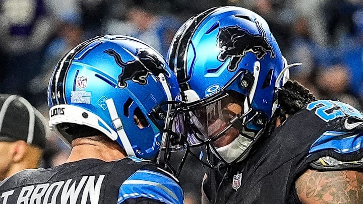 Detroit Lions running back Jahmyr Gibbs (26), right, celebrates a touchdown with wide receiver Amon-Ra St. Brown (14).