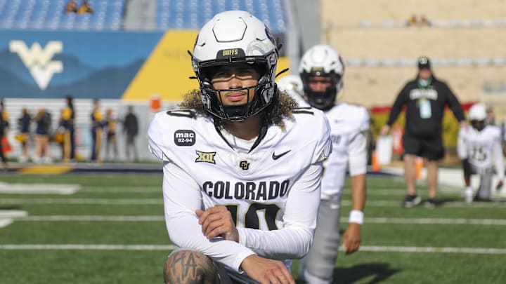 Nov 8, 2025; Morgantown, West Virginia, USA; Colorado Buffaloes quarterback Julian Lewis (10) warms up prior to their game against the West Virginia Mountaineers at Milan Puskar Stadium. Mandatory Credit: Ben Queen-Imagn Images Nov 8, 2025; Morgantown, West Virginia, USA; Colorado Buffaloes quarterback Julian Lewis (10) warms up prior to their game against the West Virginia Mountaineers at Milan Puskar Stadium. Mandatory Credit: Ben Queen-Imagn Images
