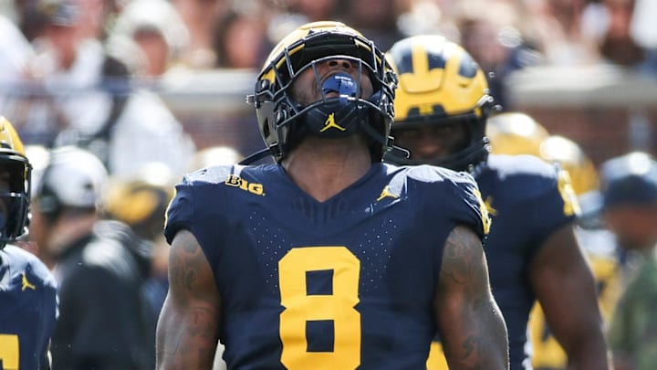 Michigan defensive end Derrick Moore (8) celebrates a tackle against UNLV during the first half at Michigan Stadium in Ann Arbor on Saturday, Sept. 9, 2023.