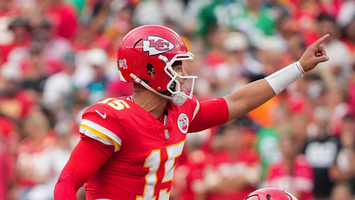 Sep 14, 2025; Kansas City, Missouri, USA; Kansas City Chiefs quarterback Patrick Mahomes (15) gestures at the line of scrimmage against the Philadelphia Eagles during the game at GEHA Field at Arrowhead Stadium.  