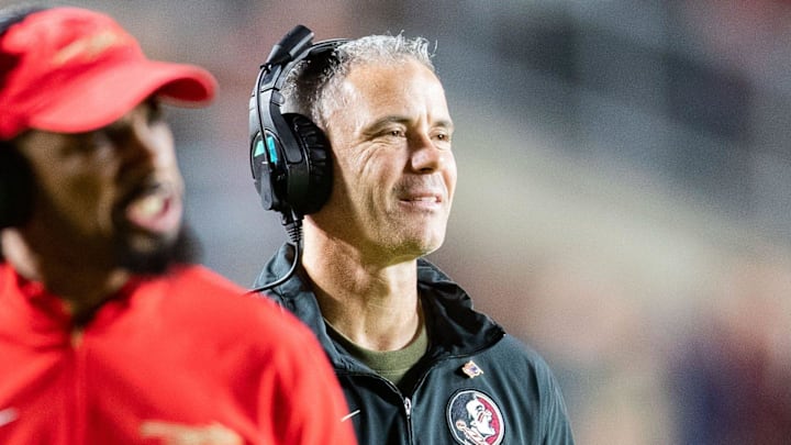 Florida State Seminoles head coach Mike Norvell smiles after his players score a touchdown. The Florida State Seminoles defeated the Miami Hurricanes 27-20 on Saturday, Nov. 11, 2023.