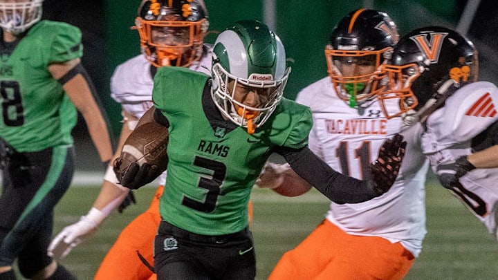 St. Mary’s Kenneth Moore III, center, gets past Vacaville’s Elijah Cline, left, Brody Rogers, Roman Conner-Owens and Koby Ortiz during a Sac-Joaquin Section football Div. 2 quarterfinal at St Mary’s High School in Stockton. St.Mary’s won 43-7. St. Mary’s Kenneth Moore III, center, gets past Vacaville’s Elijah Cline, left, Brody Rogers, Roman Conner-Owens and Koby Ortiz during a Sac-Joaquin Section football Div. 2 quarterfinal at St Mary’s High School in Stockton. St.Mary’s won 43-7.