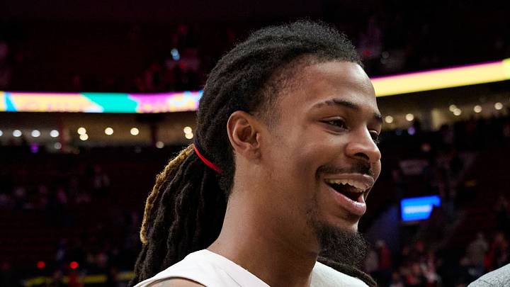 Portland Trail Blazers guard Ja Morant greets Memphis Grizzlies coaching staff after a game.