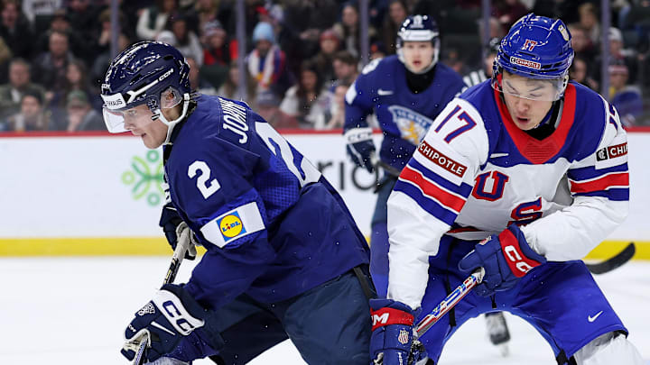 Jan 2, 2026; St. Paul, Minnesota, UNITED STATES; United States forward Ryker Lee (17) and Finland defenseman Mitja Jokinen (2) compete for the puck during the third period in the quarterfinals of the 2026 IIHF World Junior Championship at Grand Casino Arena. Mandatory Credit: Matt Krohn-Imagn Images Jan 2, 2026; St. Paul, Minnesota, UNITED STATES; United States forward Ryker Lee (17) and Finland defenseman Mitja Jokinen (2) compete for the puck during the third period in the quarterfinals of the 2026 IIHF World Junior Championship at Grand Casino Arena. Mandatory Credit: Matt Krohn-Imagn Images