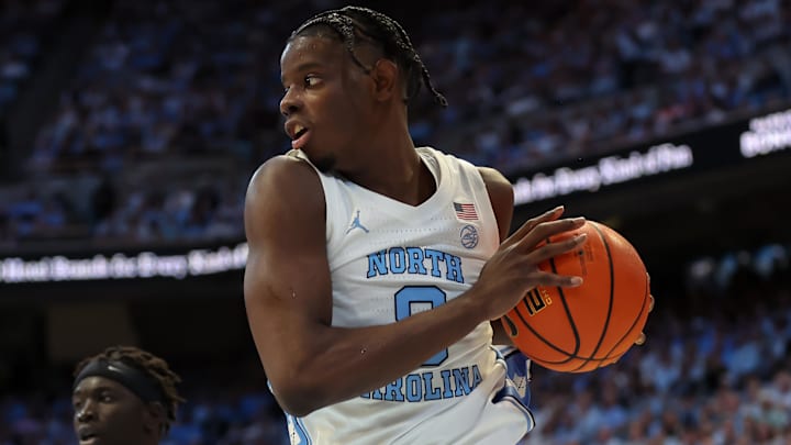 Jan 10, 2026; Chapel Hill, North Carolina, USA; North Carolina Tar Heels forward Caleb Wilson (8) grabs a rebound against the Wake Forest Demon Deacons during the first half at Dean E. Smith Center. Mandatory Credit: Cory Knowlton-Imagn Images